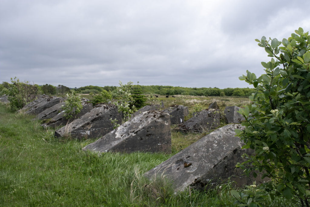 Brusand, Norway - June 3, 2022: Hitlertennene was a defense structure. It was built by the Germany during the Second World War. Large stone and concrete blocks were placed here. Selective focus.